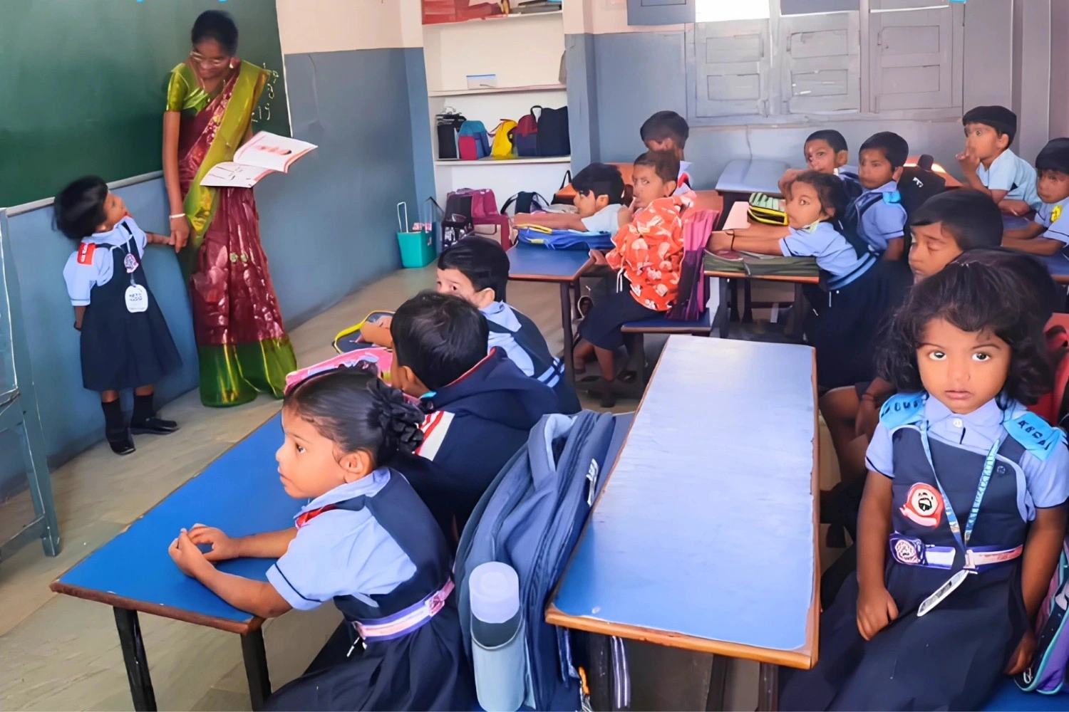 Teacher engaging young students in classroom